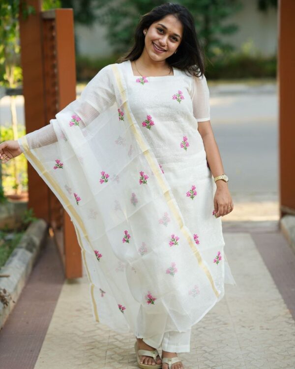 The intricately embroidered Kota Doriya kurti, complete with a soft cotton lining, pairs gracefully with a full-size Kota Doriya dupatta and tailored cotton pants. Perfect for showcasing the purity and sophistication of white on any special occasion*